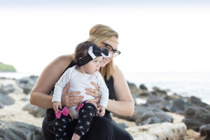 mom and baby watch the waves