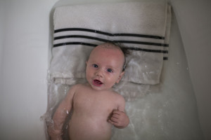 baby boy playing in tub