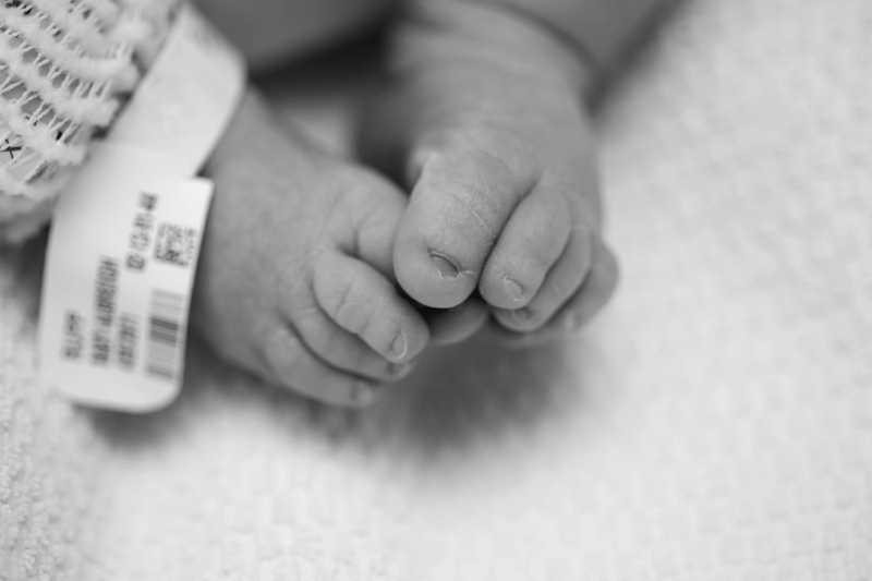 Baby Posed on a blanket backdrop Posed Newborn Session