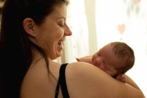 mom smiling at baby
