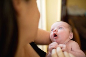 baby looking at mom