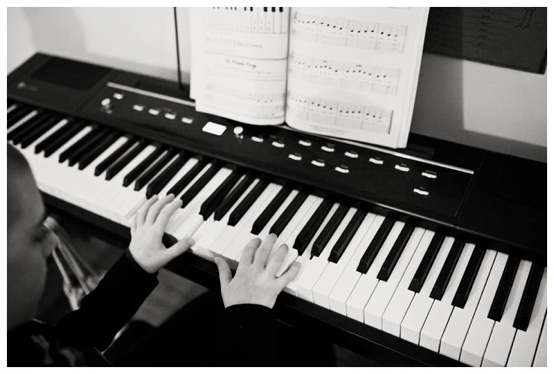 boy plays piano