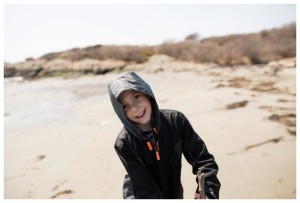 a little boy in a black jacket