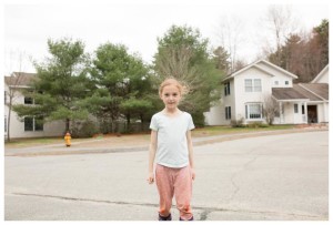 girl poses in street