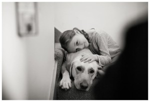 girl poses with her dog