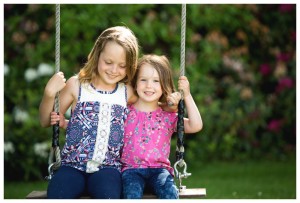 sisters on a swing