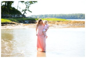 Mom and baby walking in water