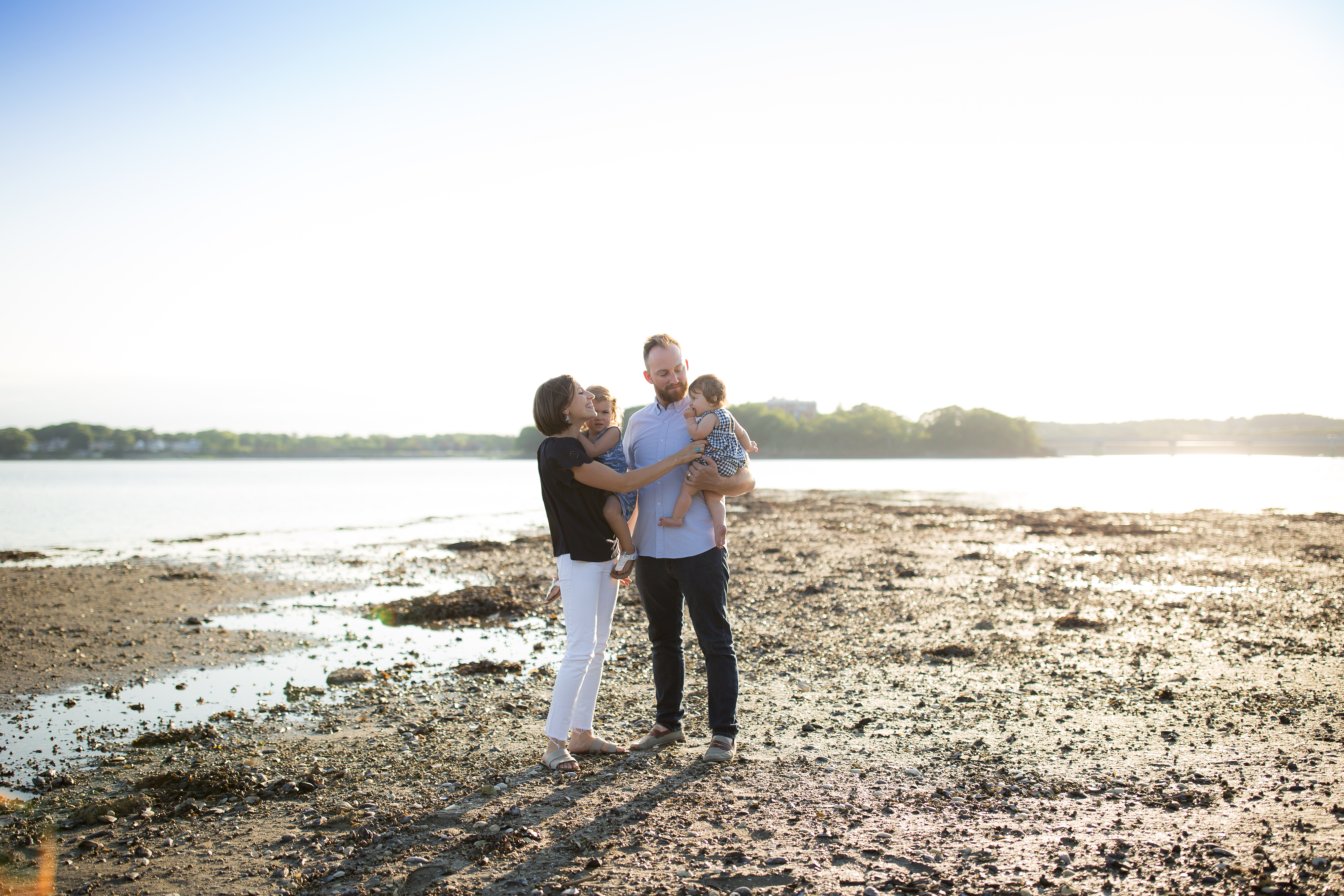 family in mud flats of midcoast maine
