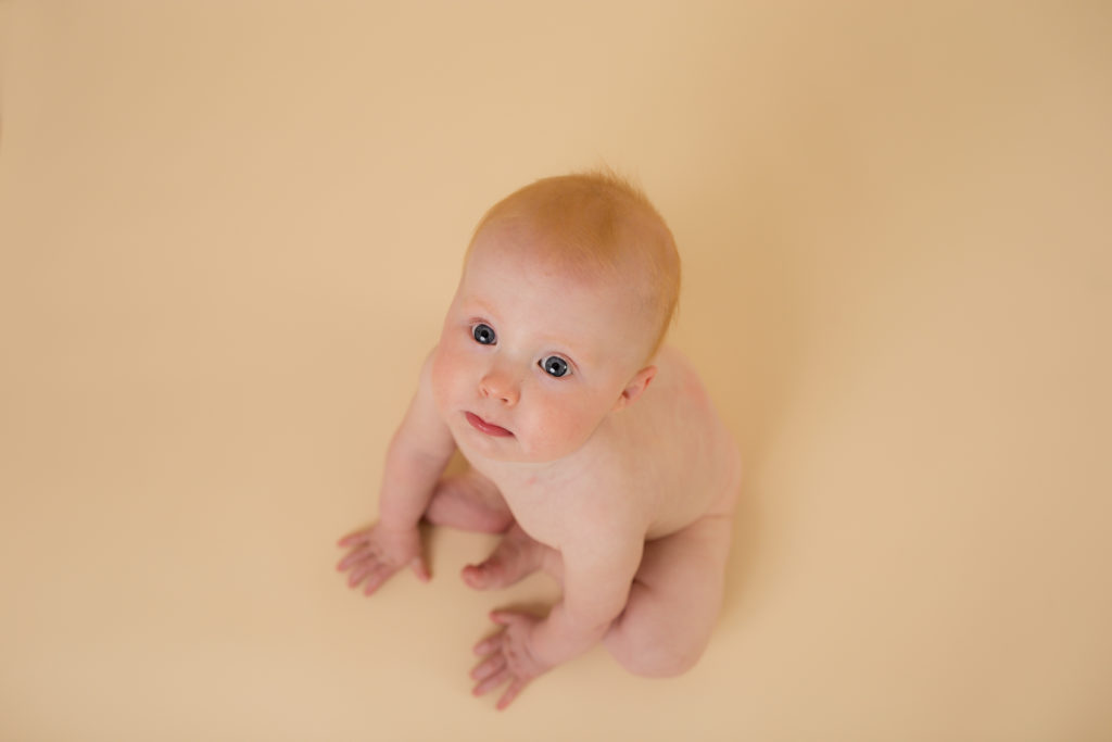 baby on cream backdrop