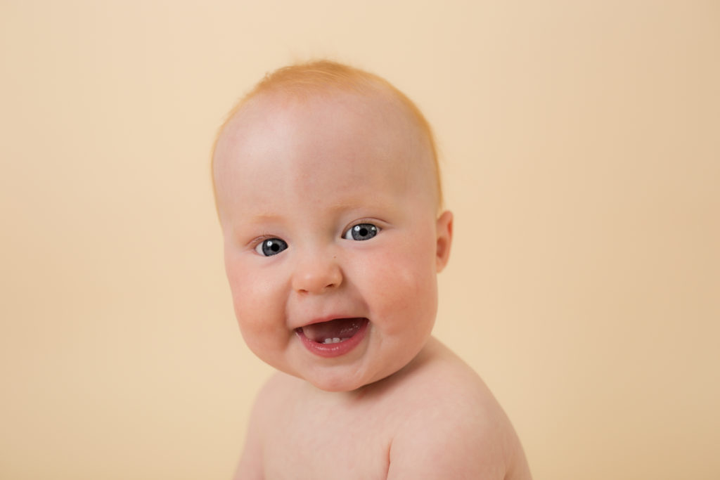 baby on cream backdrop