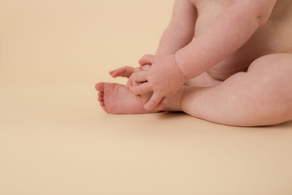 baby on cream backdrop