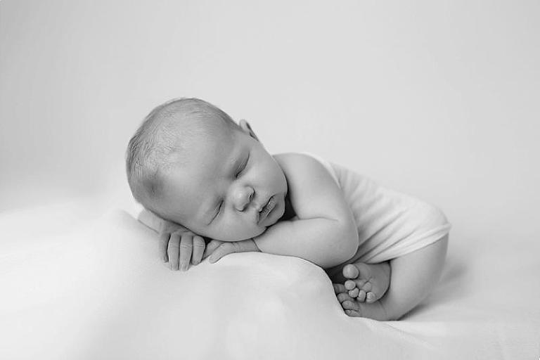 newborn posed on blanket