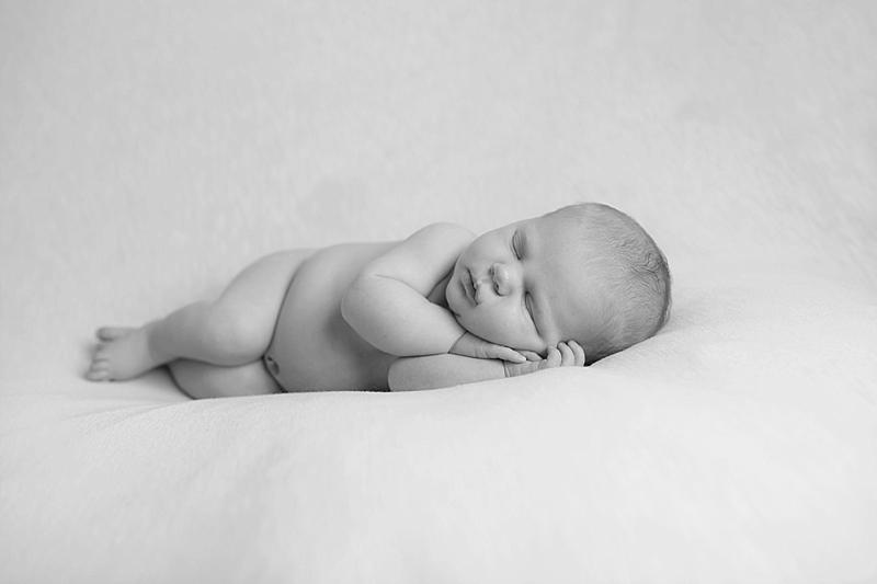 baby snuggled on blanket in brunswick me