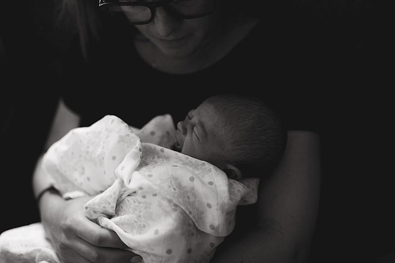 baby fusses in moms arms