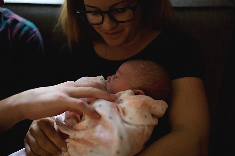 baby sucks on dads finger