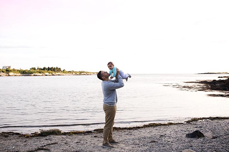 dad holds up baby boy