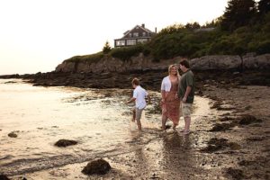 family playing in the beach of lands end