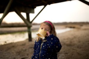 little girl eats cake
