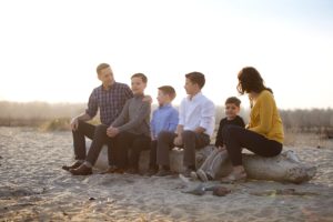 family on driftwood at silver sands