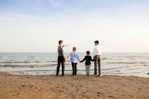 brothers playing on beach