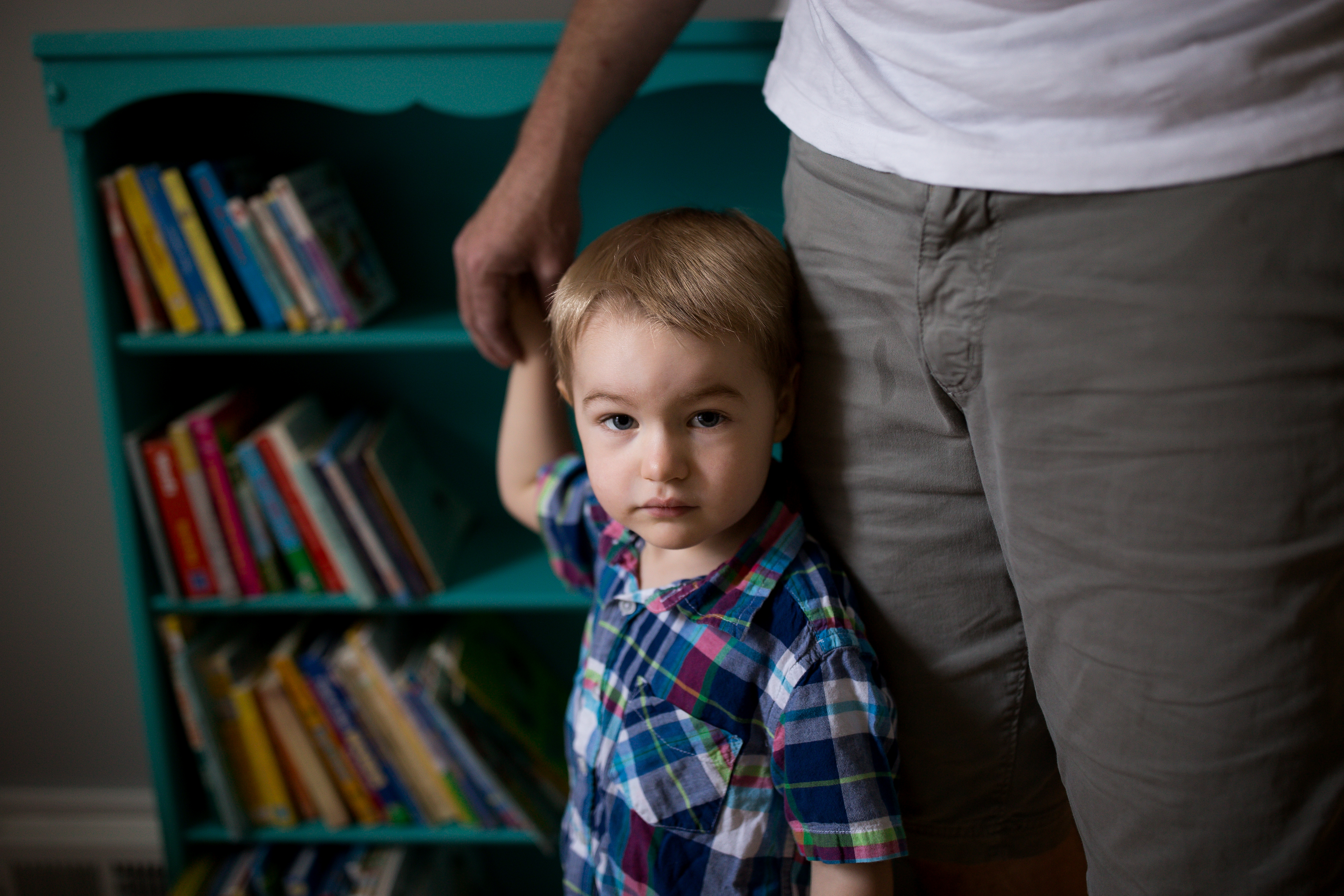 boy holds dads hand