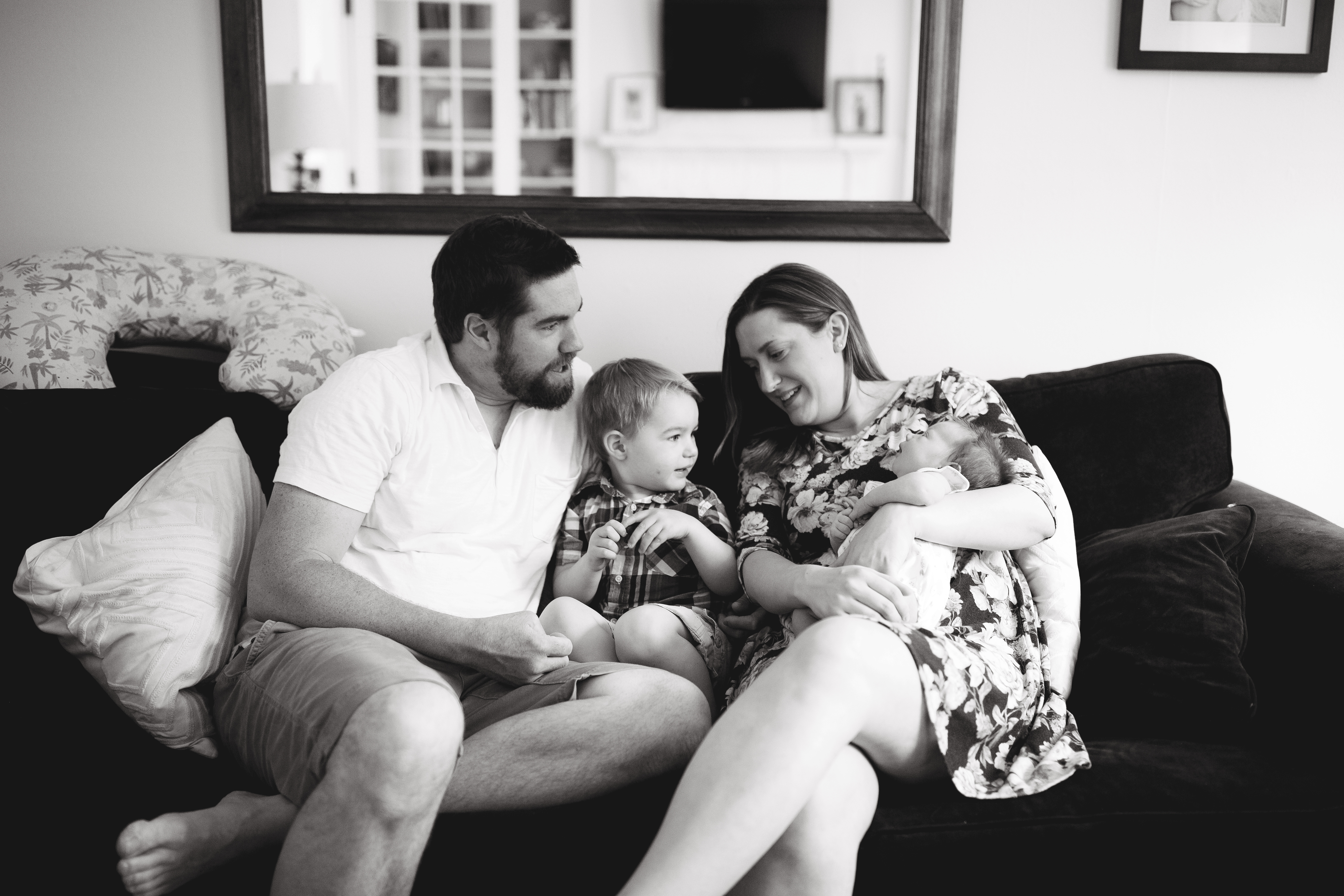 family sits on couch
