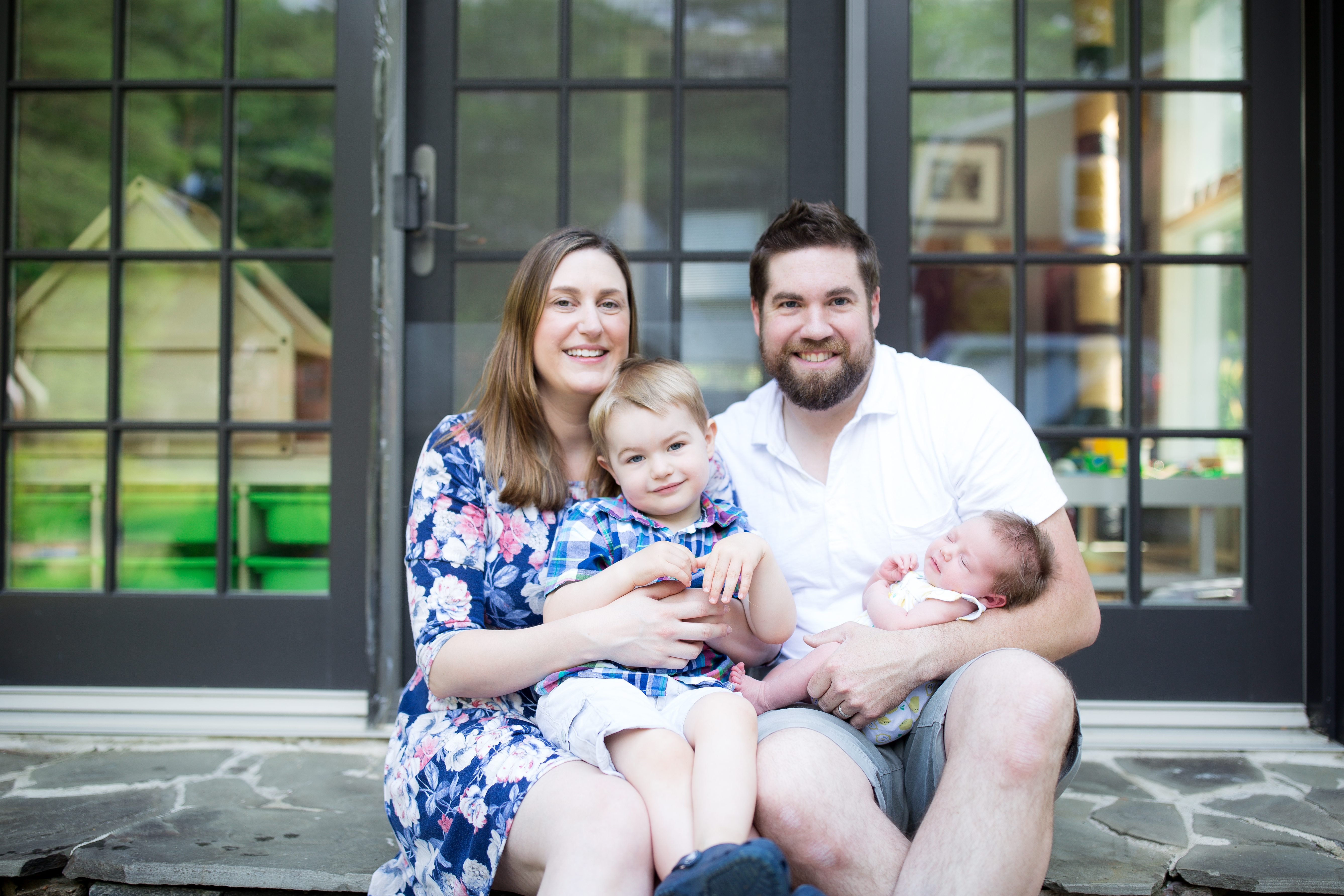 family sits in back yard