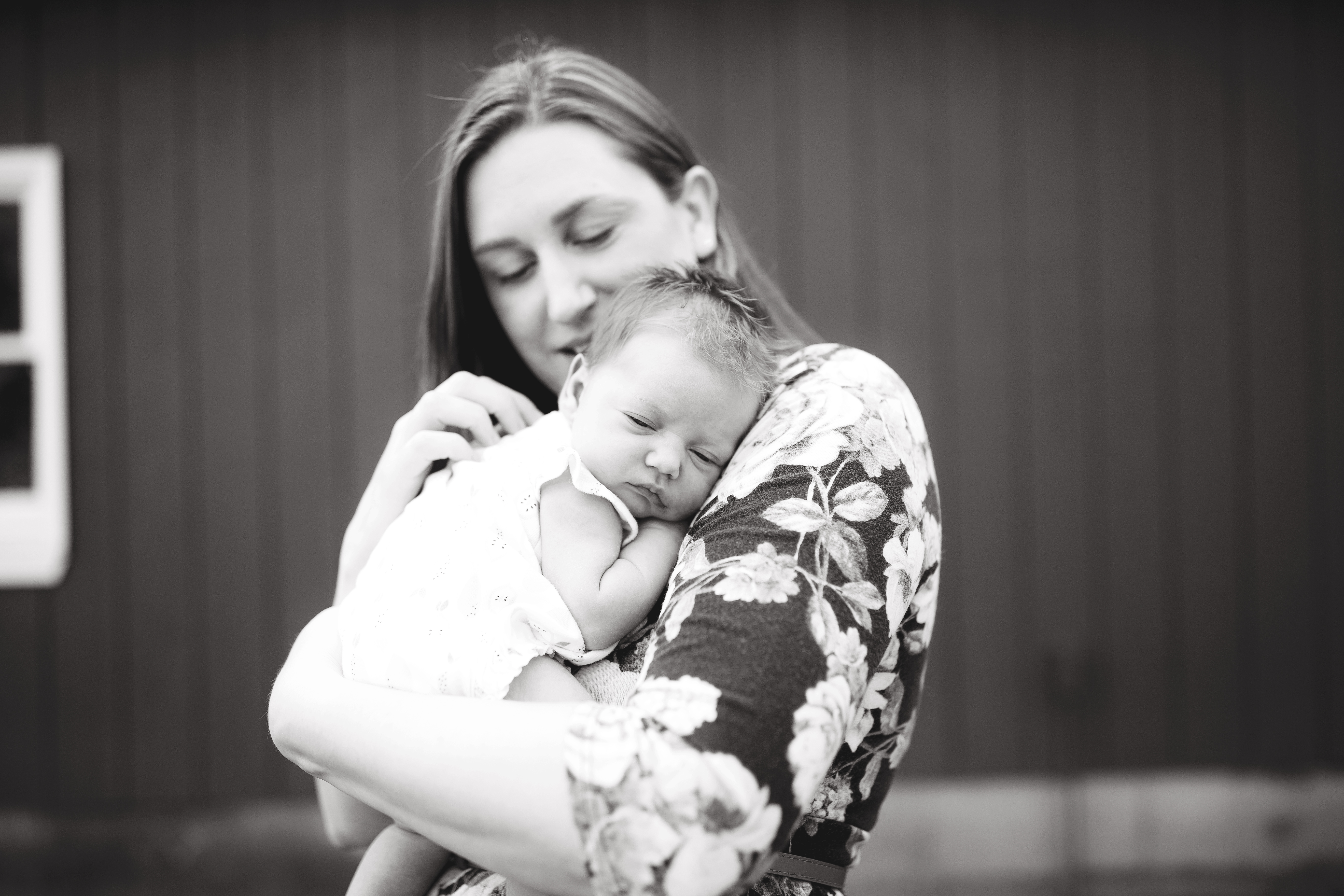 baby snuggled in moms arms
