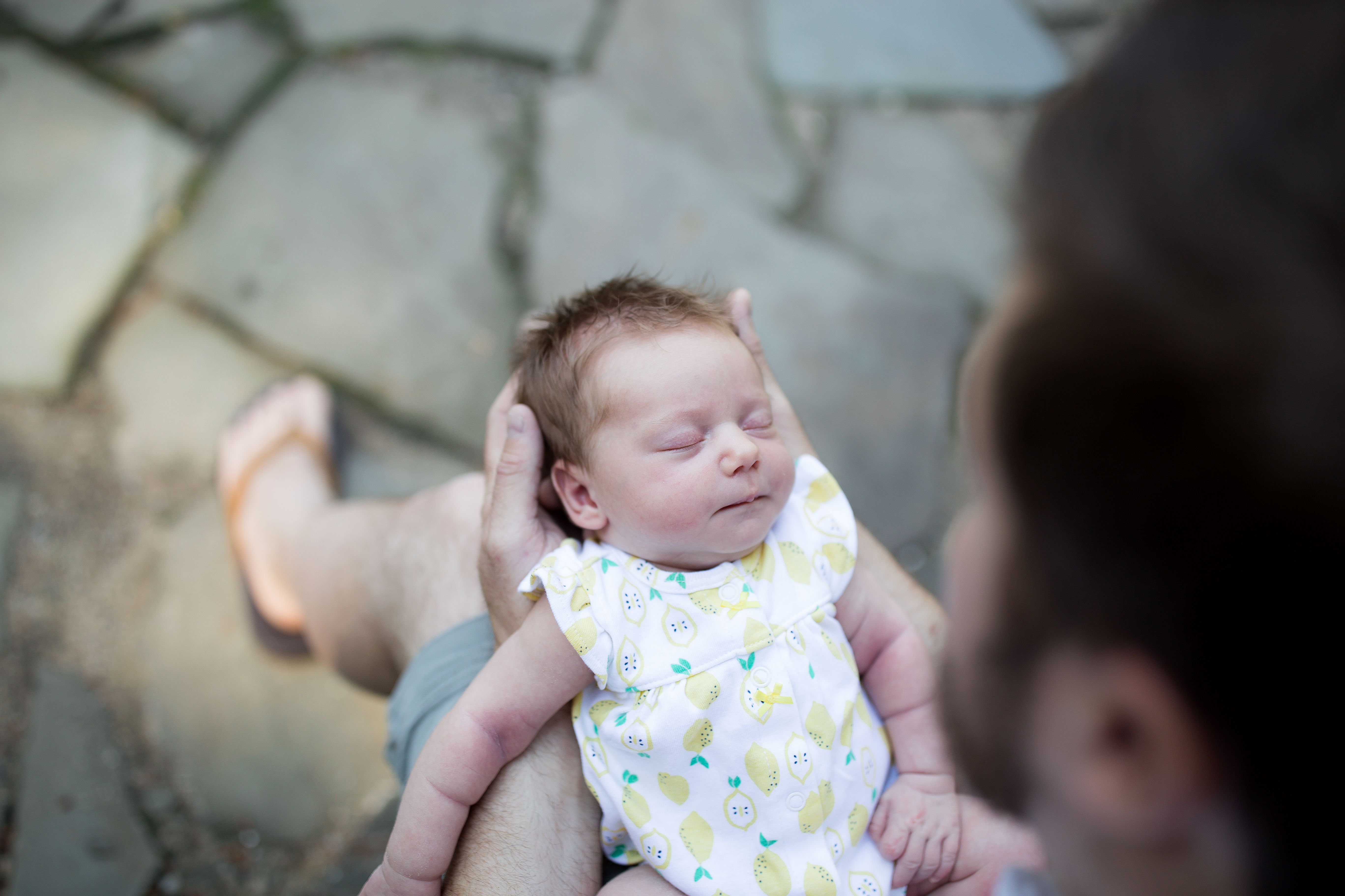 baby in dad's hands