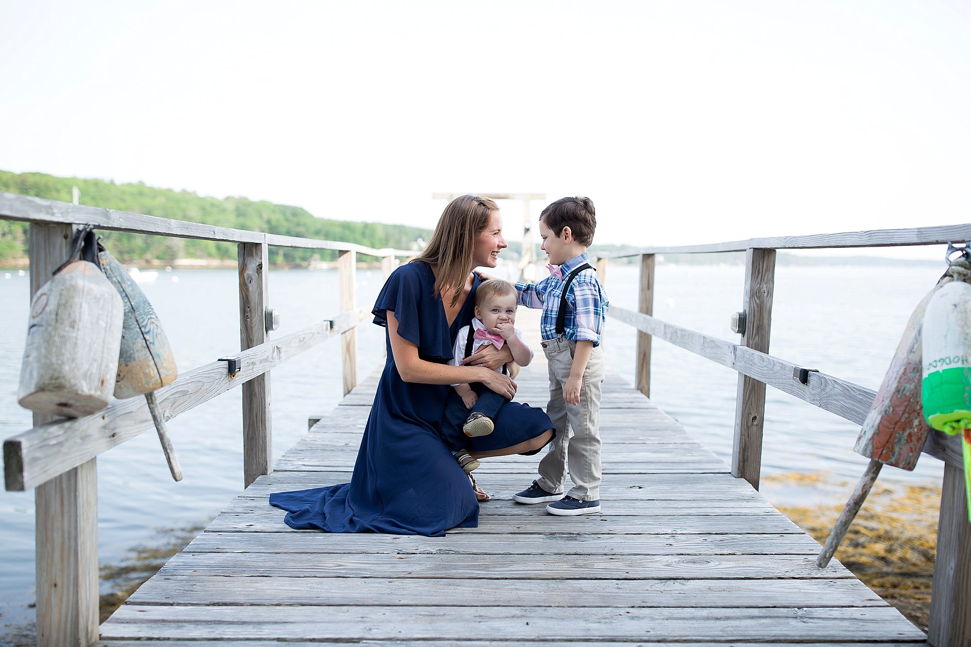 Mom laughs with her songs on a pier in Boothbay