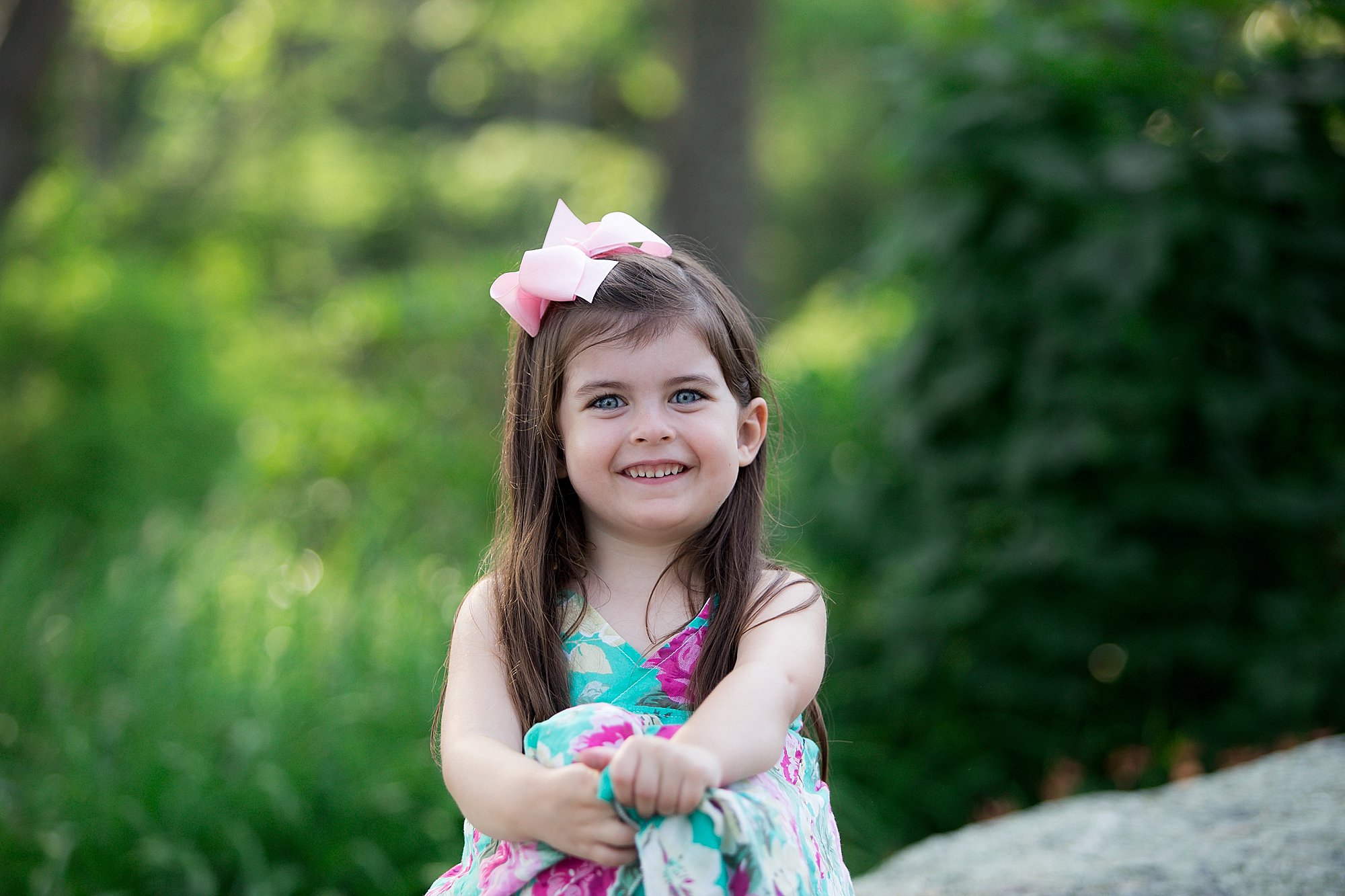 little girl hugs knees