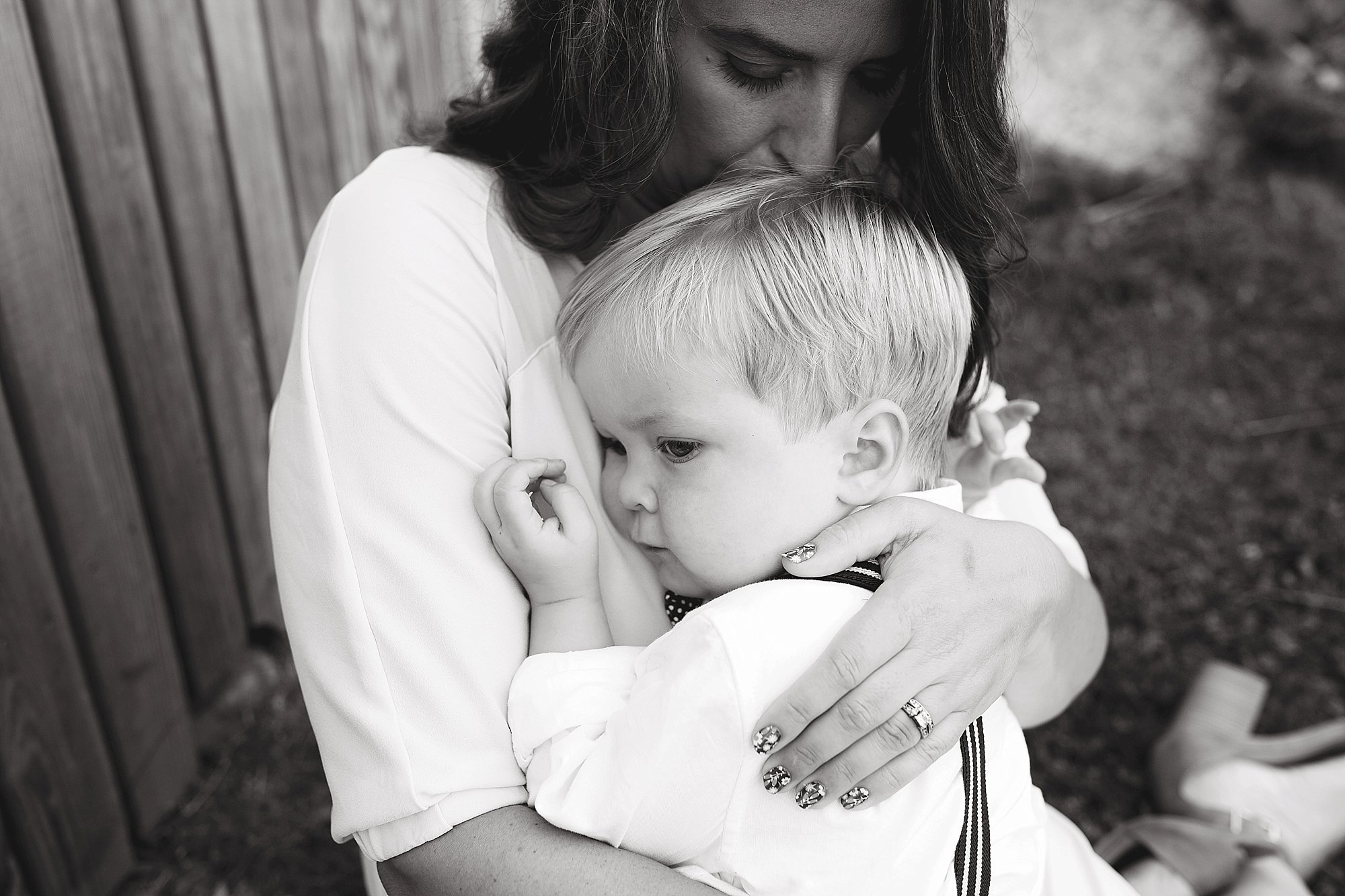 Boy snuggles mama in Boothbay Maine