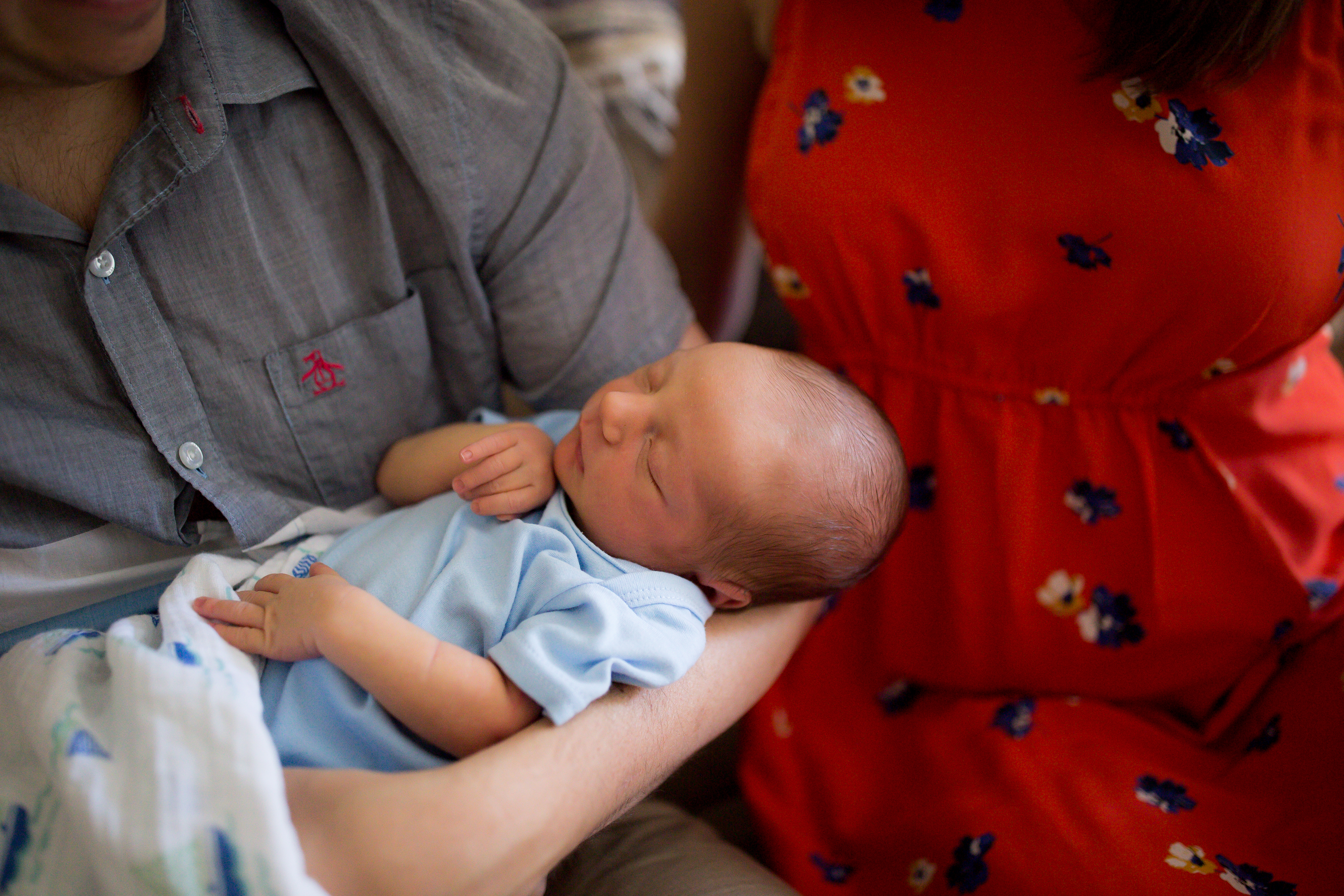 baby snuggled in with mom and dad