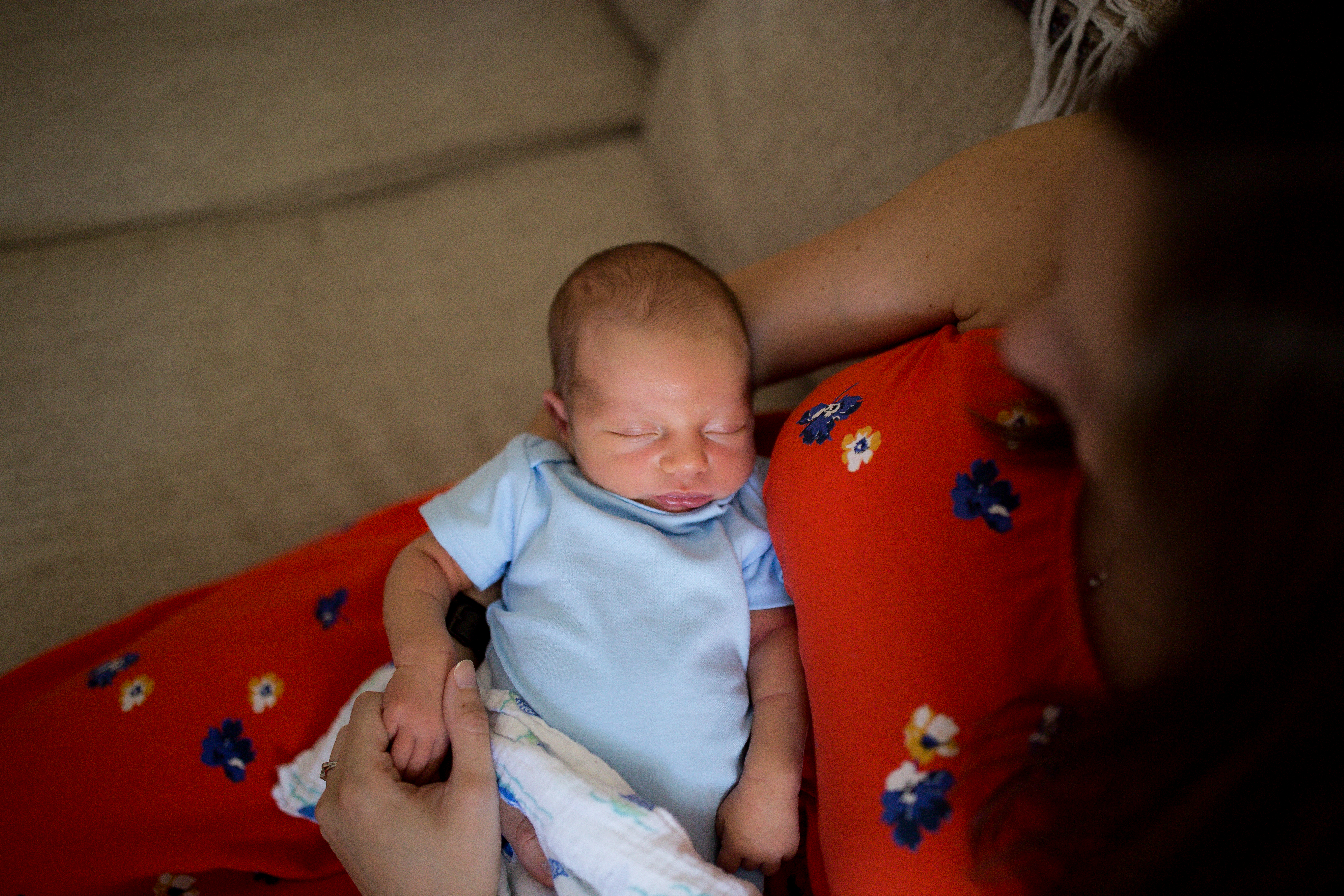 newborn baby on couch