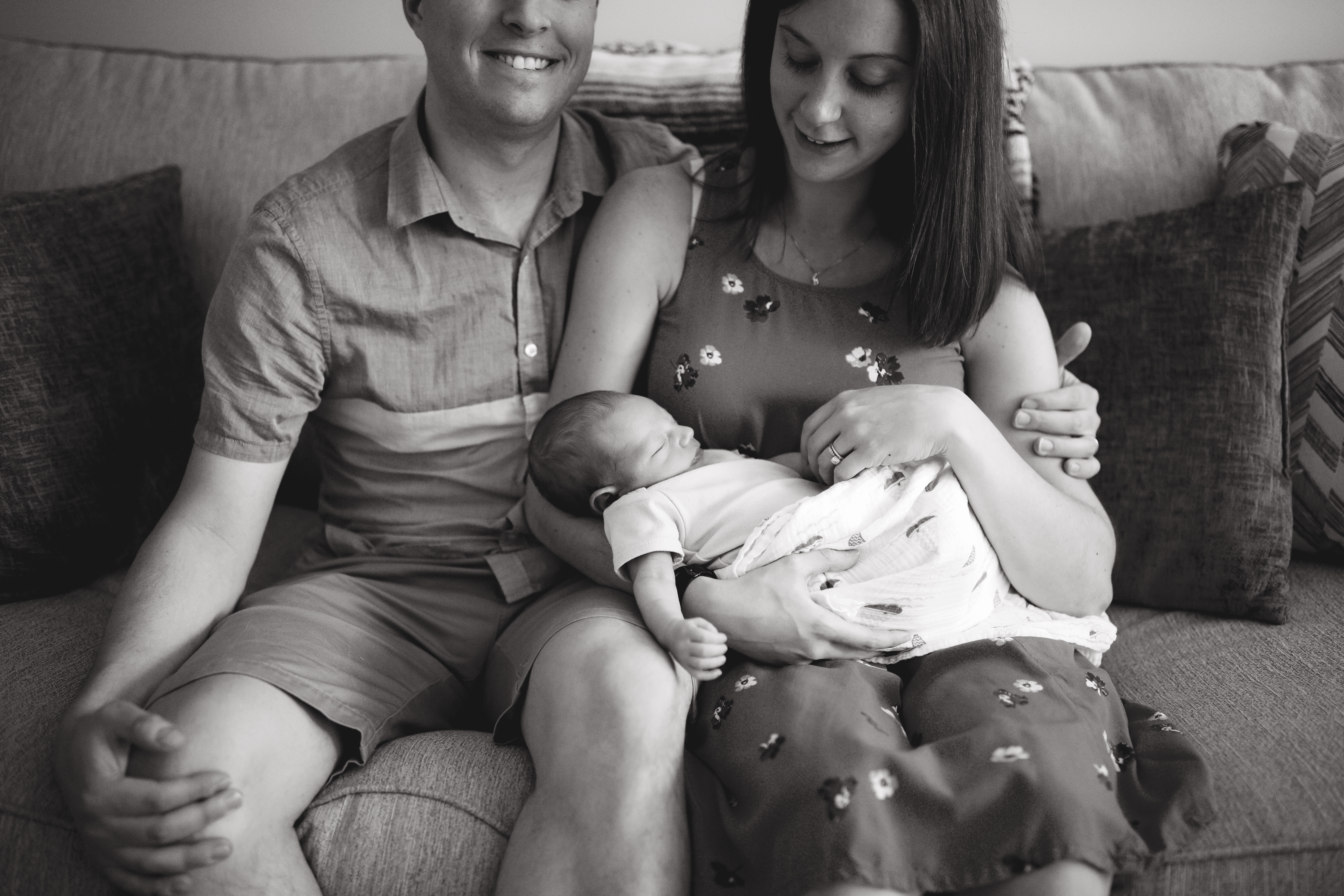 black and white image of family on couch