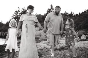 family walks on beach in harpswell maine