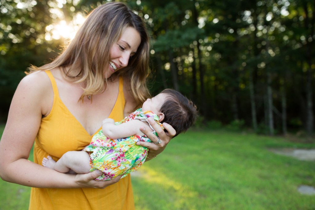 woman holds new baby