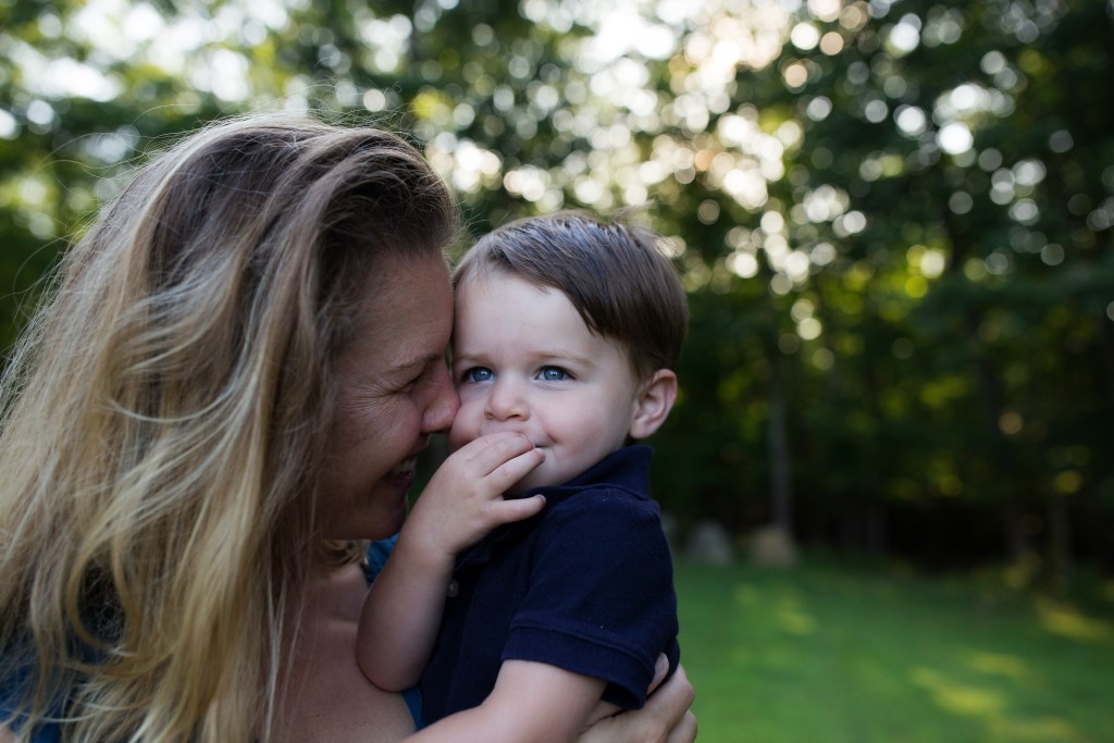 mother snuggles son