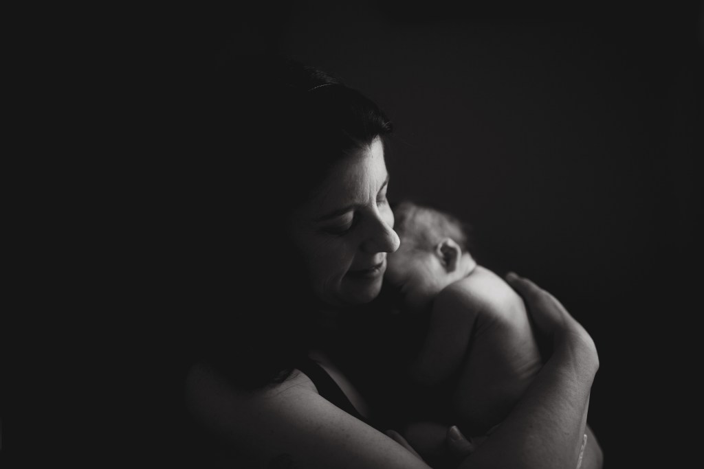 mother holds newborn